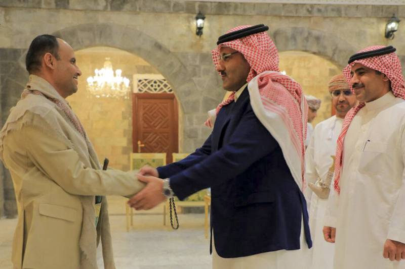 Houthi political leader Mahdi Al Mashat, left, welcomes the Saudi ambassador to Yemen, Mohammed Al Jaber and a delegation in Sanaa. AFP