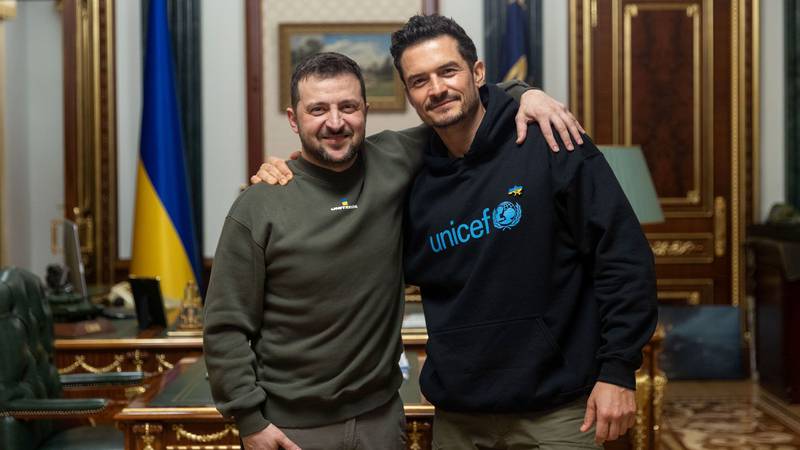 Ukrainian President Volodymyr Zelenskyy poses for a photo with British actor and Unicef Goodwill Ambassador Orlando Bloom during their meeting in Kyiv, Ukraine, on March 26. AP