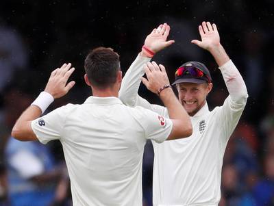 Cricket - England v India - Second Test - Lord’s, London, Britain - August 12, 2018   England's James Anderson celebrates with Joe Root after taking the wicket of India's KL Rahul (not pictured)    Action Images via Reuters/Paul Childs