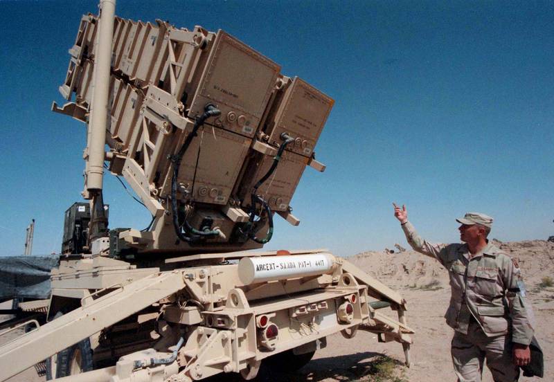 A US soldier inspects a Patriot missile launcher at a desert airbase in Kuwait, in February 1998. Reuters