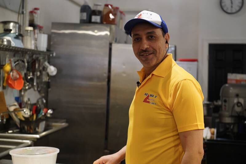 Youssef Ibrahim poses for a picture in the kitchen of his restaurant in York, Pennsylvania. Willy Lowry / The National.