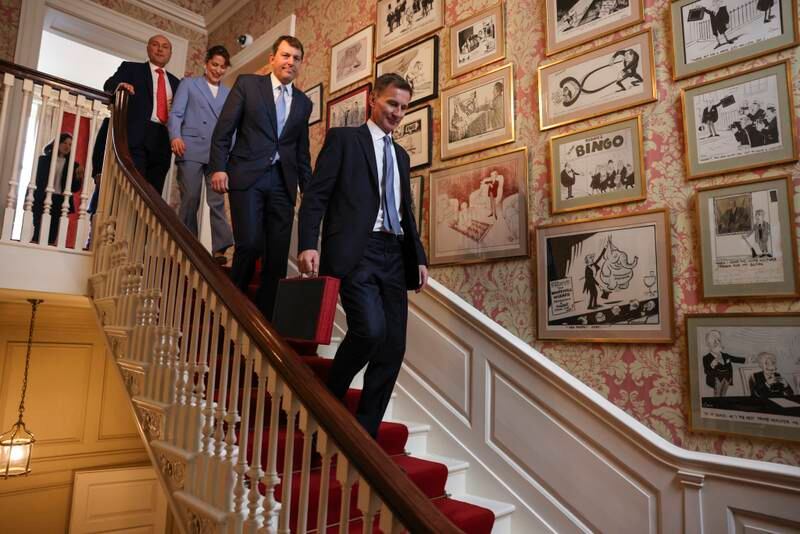 Mr Hunt and his team make their way through No 11 Downing Street. Photo: No 10 Downing Street