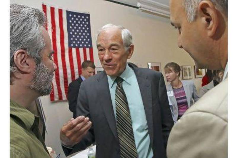 US presidential candidate Ron Paul, centre, has a range of radical libertarian, conservative and small-government policy proposals but, a reader complains, his ideas get too little media attention. Jim Cole / AP