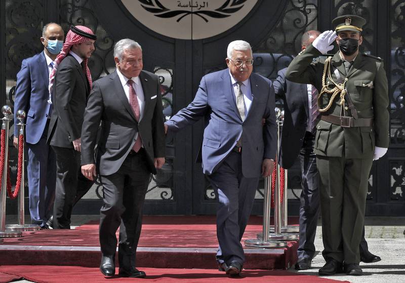 Palestinian President Mahmoud Abbas welcomes King Abdullah of Jordan before a meeting in Ramallah. AFP