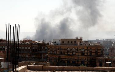 Smoke billows above Sanaa after air strikes on rebel positions on March 7, 2021, the same day as a fire at a migrant detention centre near the Yemeni capital. EPA