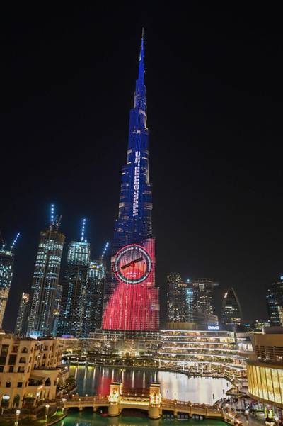 A picture taken on July 19, 2020 shows Dubai's Burj Khalifa lit up in support of the United Arab Emirates "Hope" Mars probe, ahead of it's expected launch from Japan. The probe is one of three racing to the Red Planet, with Chinese and US rockets also taking advantage of the Earth and Mars being unusually close: a mere hop of 55 million kilometres (34 million miles). "Hope" -- Al-Amal in Arabic -- is expected to start orbiting Mars by February 2021, marking the 50th anniversary of the unification of the UAE. / AFP / Giuseppe CACACE
