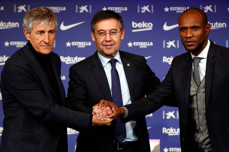 Barcelona president Josep Maria Bartomeu, centre, sports director Eric Abidal and new manager Quique Setien. EPA