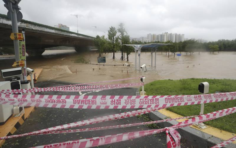 Floodwaters cover a parking lot in Ulsan, South Korea. AP
