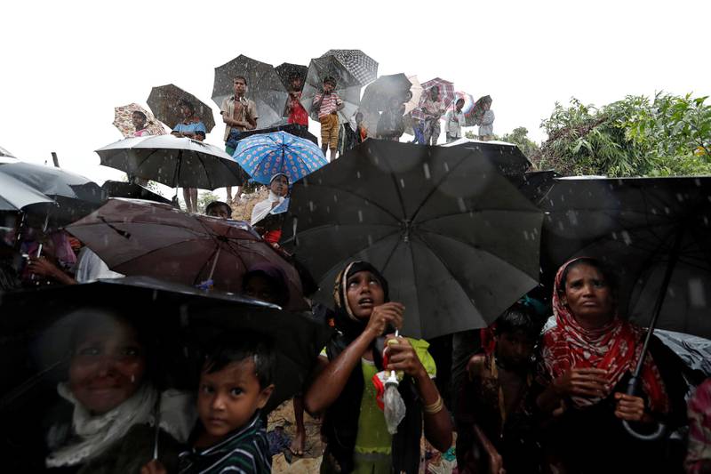 Rohingya refugees wait for aid packages in Cox's Bazar, Bangladesh. Cathal McNaughton / Reuters