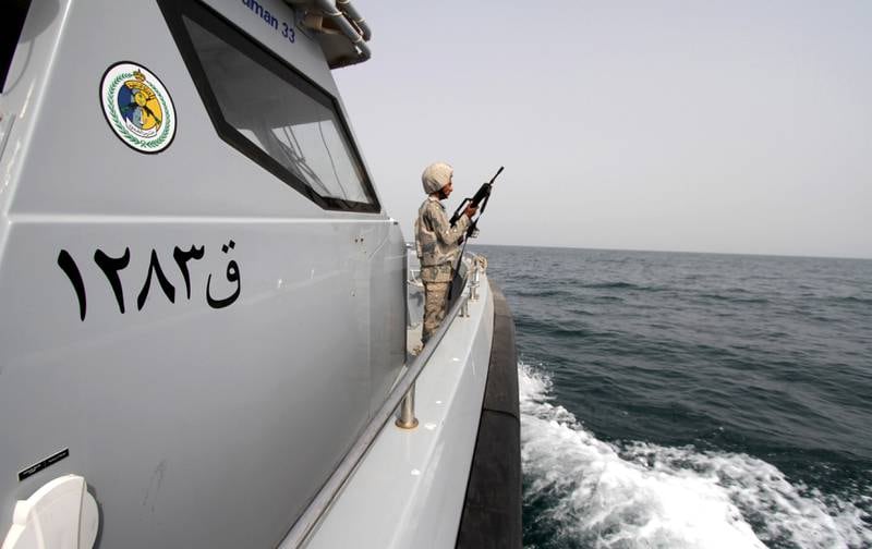 A Saudi border guard watches as he stands in a boat off the coast of the Red Sea on Saudi Arabia's maritime border with Yemen, near Jazan April 8, 2015. Reuters