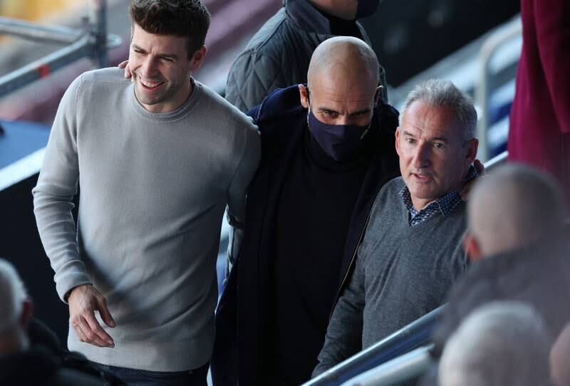 Left to right: Barcelona defender Gerard Pique, Manchester City manager Pep Guardiola and City director of football Txiki Begiristain before the press conference. Reuters
