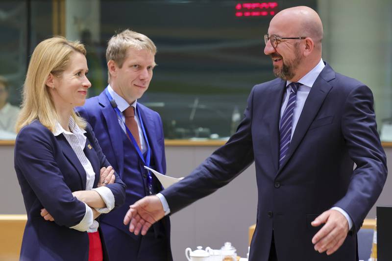European Council President Charles Michel, right, and Estonian Prime Minister Kaja Kallas, left, talk before the second day's session of an extraordinary meeting of EU leaders to discuss Ukraine, energy and food security, in Brussels. AP