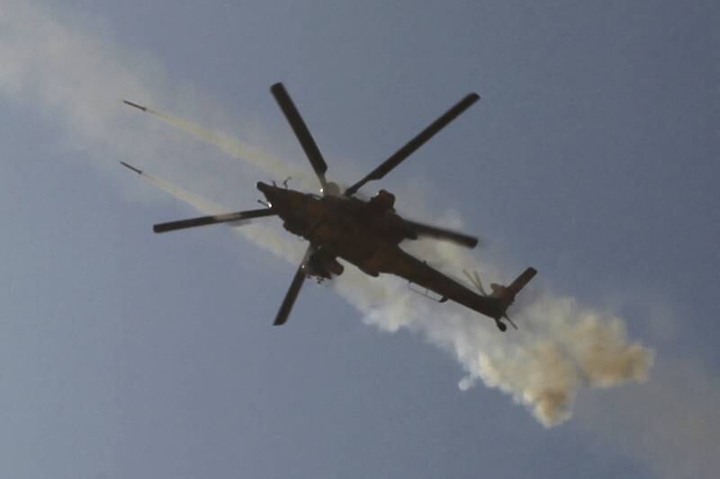 An Iraqi army helicopter fires at a target near Al Ayadieh village during an operation to retake the northern city of Tal Afar from ISIS in August 2017. AFP