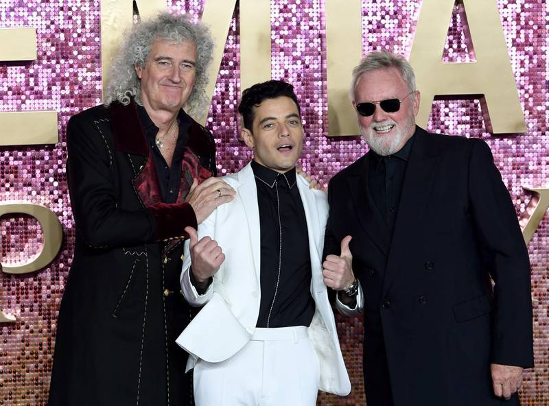 epa07114683 US actor and cast member Rami Malek (C) who plays the role of Freddie Mercury, poses with members of British rock band 'Queen' Roger Taylor (R) and Brian May (L) attend the world premiere of 'Bohemian Rhapsody' in London, Britain, 23 October 2018. The movie opens across UK theaters on 24 October.  EPA/FACUNDO ARRIZABALAGA