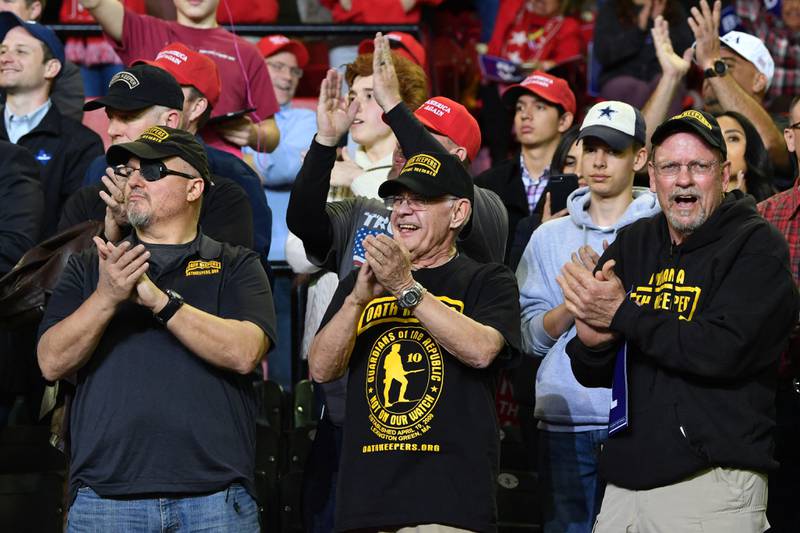 Supporters of former US president Donald Trump, including Oath Keepers founder Stewart Rhodes, cheer as they listen to Donald Trump Jr  address the audience during a rally in El Paso, Texas. AFP