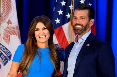 (FILES) In this file photo taken on February 3, 2020 Donald Trump Jr. (R) and his girlfriend Kimberly Guilfoyle smile during a "Keep Iowa Great" press conference in Des Moines, IA.  Donald Trump Jr's his girlfriend Kimberly Guilfoyle tested positive for the coronavirus on July 3, 2020, US media reported. / AFP / JIM WATSON

