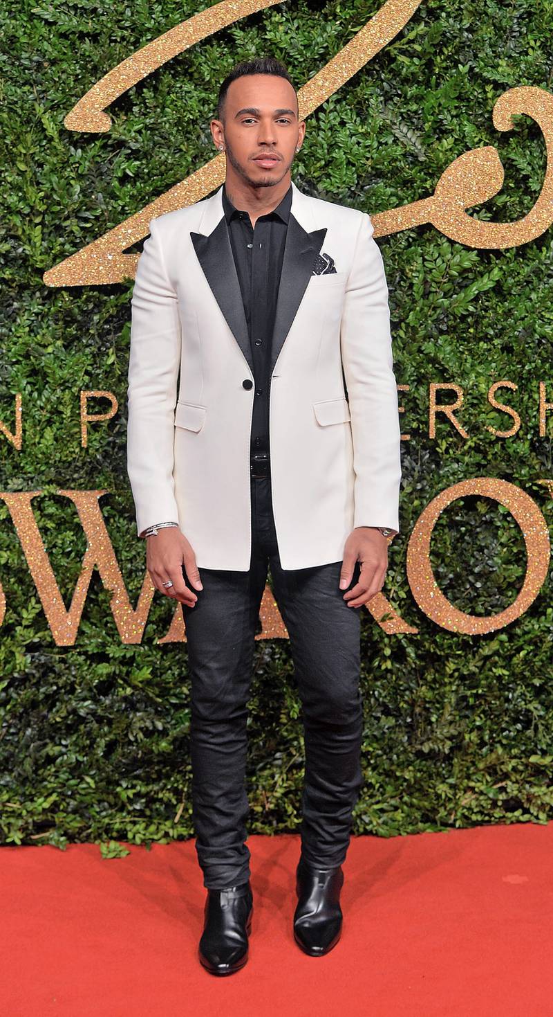 Lewis Hamilton, in a white tuxedo, attends the British Fashion Awards at the London Coliseum on November 23, 2015. Getty Images