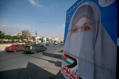 Campaign posters of candidates for the upcoming Jordanian parliamentary elections line a street in the capital Amman. AFP