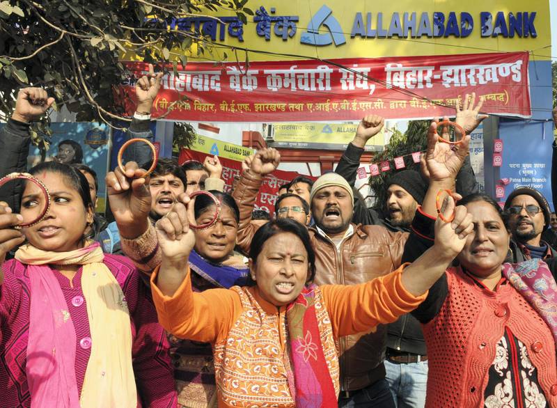 PATNA, INDIA - JANUARY 9: Members of Allahabad Bank Employees Union stage a demonstration on the second day of the two-day nationwide strike called by central trade unions on January 9, 2019 in Patna, India. The two-day nationwide strike called by 10 central trade unions in protest against what they describe as the anti-worker policies and unilateral labour reforms evoked a mixed response on its second day on Wednesday, as witnessed on the previous day. (Photo by AP Dube/Hindustan Times via Getty Images)