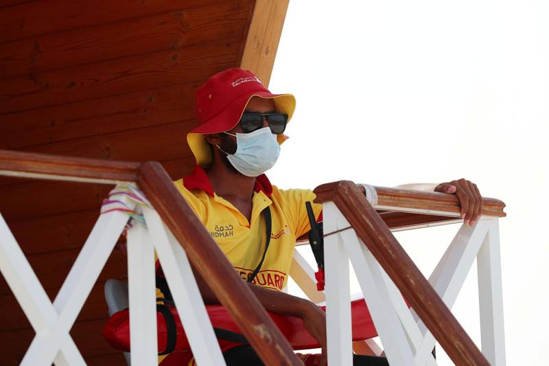 Dubai, United Arab Emirates - Reporter: N/A. Standalone. A lifeguard wears a protective face mask to protect him from Covid-19/Coronavirus. Thursday, June 25th, 2020. Dubai. Chris Whiteoak / The National