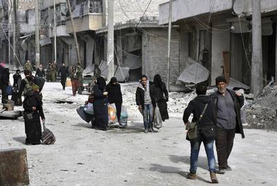 Residents flee east Aleppo as government forces pushed into rebel-held areas. AP Photo