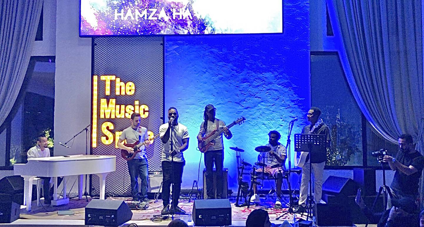 Hamza Hawsawi performs at The Music Space in Jeddah with band members, from left to right: pianist Faris Baraja, lead guitarist Yasir, guitarist Ahmed Yasin, drummer Ahmed Amin and guitarist Mohamed Abdu. Mariam Nihal for The National