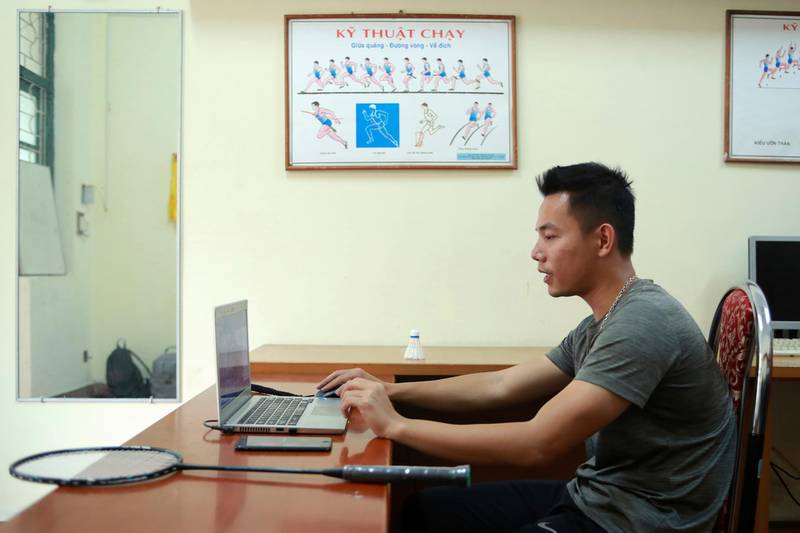 A PE teacher talks with his students during an online class at Nguyen Tat Thanh school in Hanoi, Vietnam, on March 19, 2020. AP