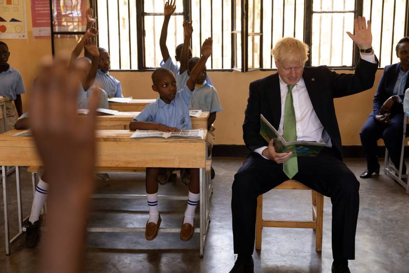 British Prime Minister Boris Johnson attends a lesson during a visit to GS Kacyiru II school, on the sidelines of the Commonwealth Heads of Government Meeting in Kigali, Rwanda.  Reuters