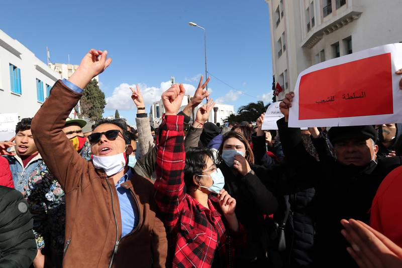 Protesters shout slogans during a demonstration next to the Tunisian parliament in Tunis, Tunisia. EPA