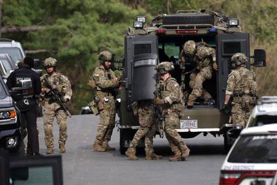 Armoured vehicles were brought to the scene of the shooting. Getty Images / AFP
