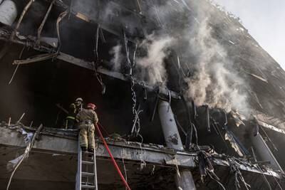 Firefighters work at the site of a shopping centre bombing in Kyiv. Reuters