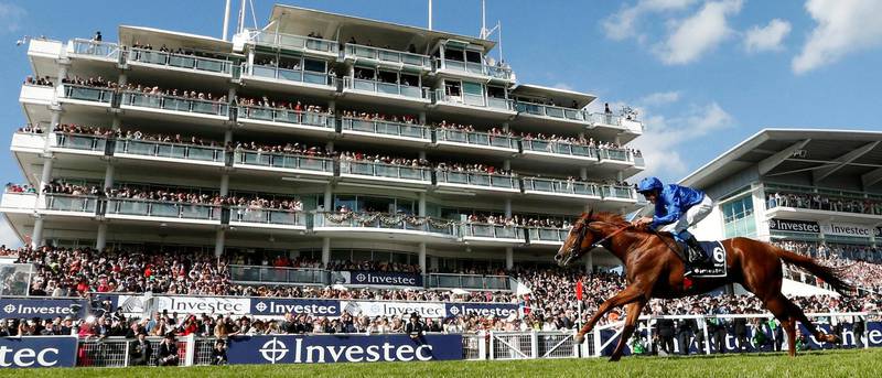 Horse Racing - Derby Festival - Epsom Downs Racecourse, Epsom, Britain - June 2, 2018   Masar ridden by William Buick in action as he wins the 4.30 Investec Derby   Action Images via Reuters/Andrew Boyers