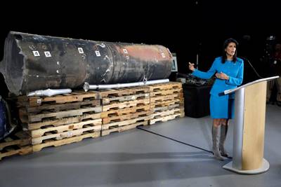 U.S. Ambassador to the United Nations Nikki Haley briefs the media in front of remains of Iranian "Qiam" ballistic missile provided by Pentagon at Joint Base Anacostia-Bolling in Washington, U.S., December 14, 2017. REUTERS/Yuri Gripas