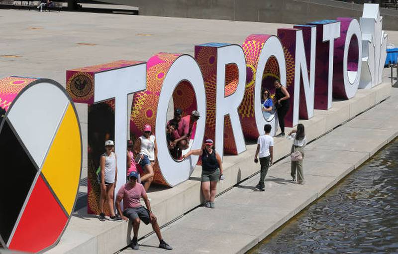 People gather at Nathan Phillips Square in Toronto. Ontario remains in stage three of its reopening as Covid-19 cases rise. Toronto Star via Getty Images