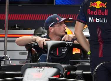Dutch Formula One driver Max Verstappen (L) of Red Bull Racing speaks with team members in the team's garage in Suzuka, Japan, 21 September 2023.  The Formula 1 Japanese Grand Prix will take place on 24 September 2023.   EPA / FRANCK ROBICHON