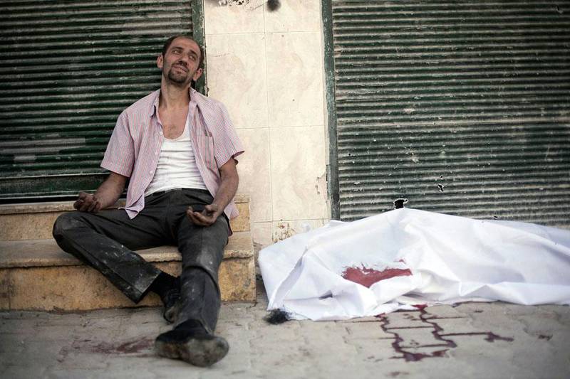 Thousand of families are being torn apart. Here a man cries near the body of his brother, again outside Dar El Shifa hospital.