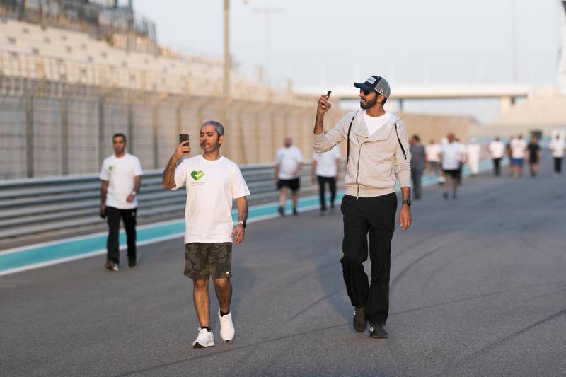 DUBAI, UNITED ARAB EMIRATES - Feb 18, 2018.

 Sheikh Shakhbout bin Nahyan Al Nahyan, left, UAE Ambassador to the Kingdom of Saudi Arabia, takes part at MOFA's  walk.

After the 12th Ministry of Foreign Affairs Ambassadors' Forum, the ministry organized a walk around Yas Marina Circuit. 

(Photo: Reem Mohammed/ The National)

Reporter:
Section: NA