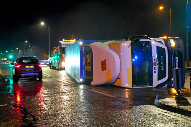 A lorry blown over by high winds blocks a road near Hartlepool, County Durham. Photo: PA