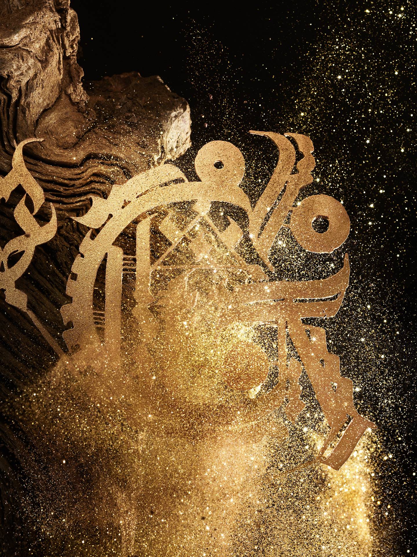 Artist Tarek Benaoum reinterpreted Guerlain's double G motif in his calligraphic style, illuminated with gold and ochre tones. Photo: Guerlain