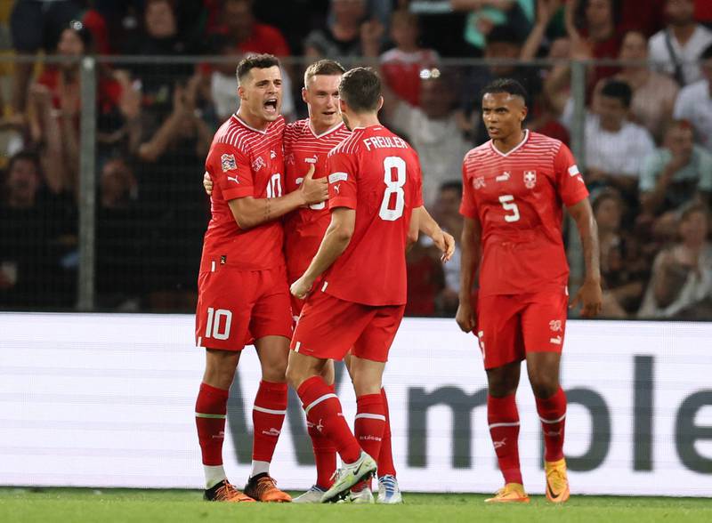 Switzerland's Granit Xhaka celebrates with teammates after the Uefa Nations League victory over Portugal in June. Reuters