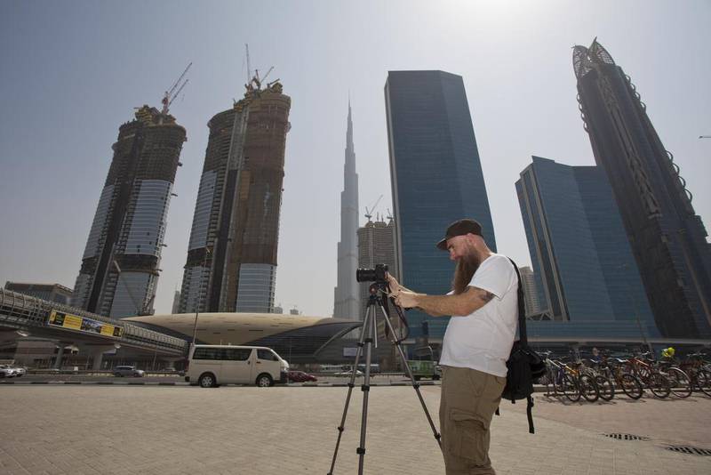 Logan Hicks took thousands of photos to capture the city’s essence for the mural, which will be his contribution to the Dubai Walls initiative. It will likely take months to complete.  Randi Sokoloff for The National
