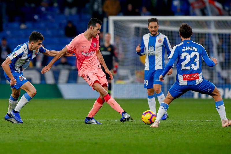 Barcelona midfielder Sergio Busquets, centre, in action against Espanyol. AP Photo
