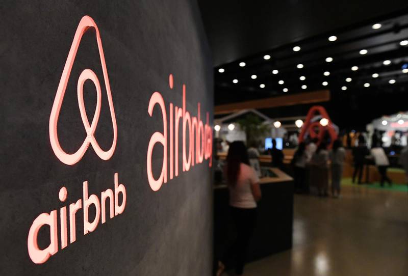 (FILES) In this file photo taken on June 14, 2018 the US rental site Airbnb logo is displayed during the company's press conference in Tokyo. A decade ago a pair of San Francisco roommates decided to make rent money by using air mattresses to turn their place into a bed-and-breakfast when a conference in the city made hotel rooms scarce. The brainwave led to the creation of Airbnb, a startup now valued at more than $30 billion which boasts millions of places to stay in more than 191 countries, from apartments and villas to castles and treehouses.
 / AFP / Toshifumi KITAMURA
