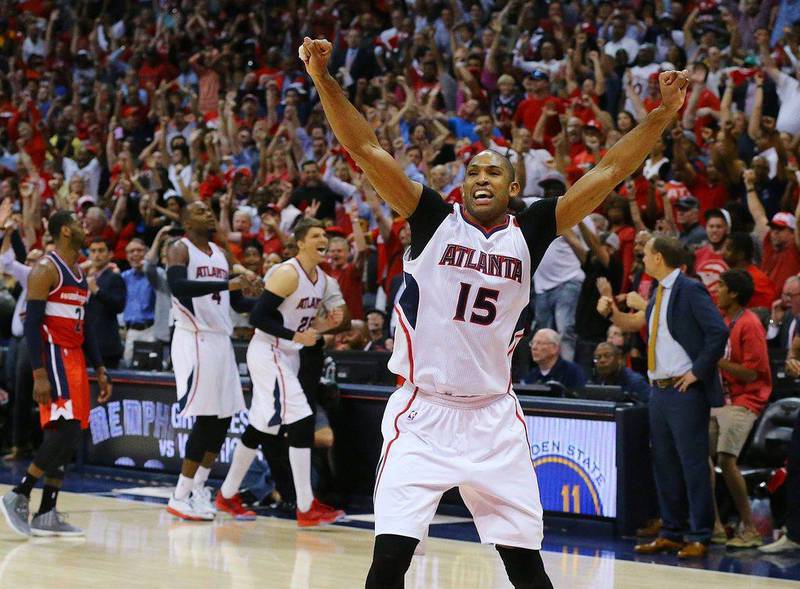 Al Horford of the Atlanta Hawks celebrates making the last-second winning shot against the Washington Wizards on Wednesday in Game 5 of their NBA play-offs second round series. Curtis Compton / Atlanta Journal-Constitution / AP / May 13, 2015 