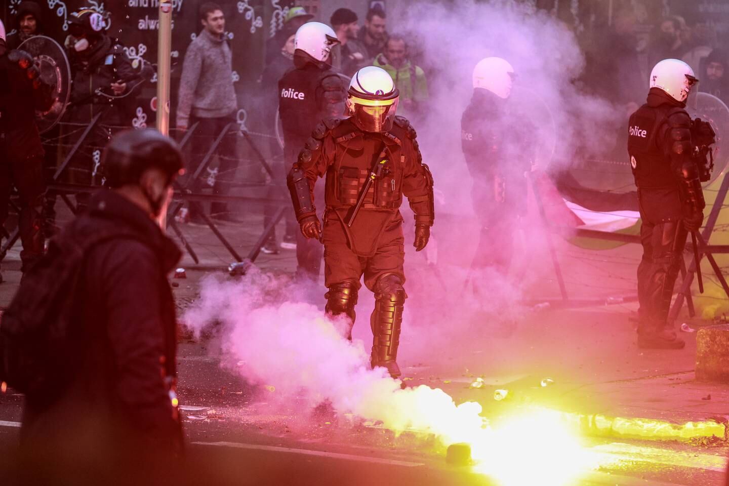Protesters face riot police during a protest in Brussels, Belgium. EPA 