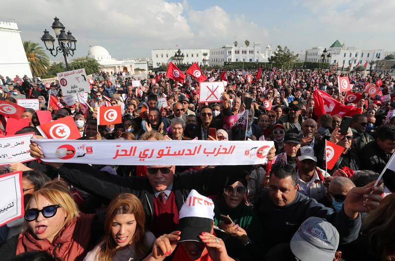 Supporters of Tunisia's Free Destourian Party take part in a protest demanding the dissolution of Parliament and asking for early legislative elections next to the government palace in Tunis. EPA