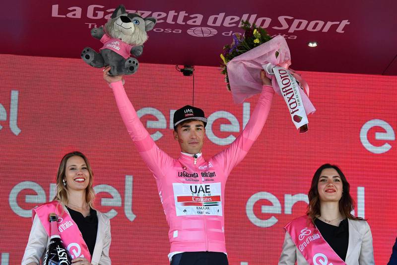 epa07576235 Italian rider Valerio Conti of UAE Team Emirates, celebrates on the podium wearing the overall leader's pink jersey after the 6st stage of the 102nd Giro d'Italia cycling race, over 238 km from Cassino to San Giovanni Rotondo, Italy, 16 May 2019.  EPA/ALESSANDRO DI MEO