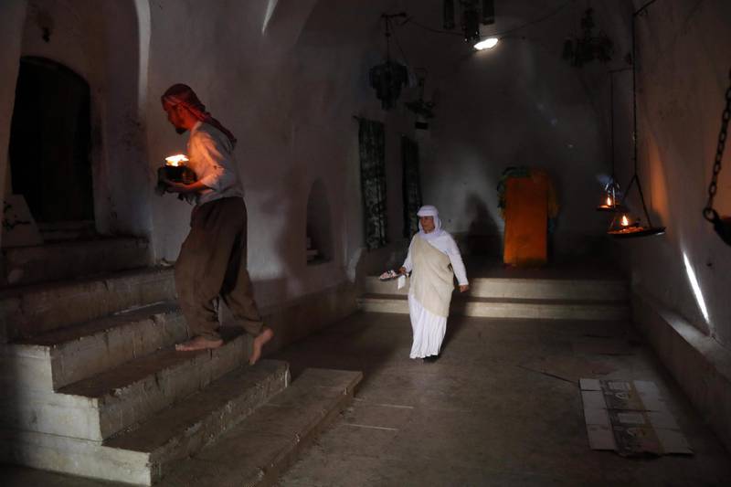 Iraqi Yezidis visit the Temple of Lalish, in a valley near the Kurdish city of Dohuk about 430km northwest of the capital Baghdad, on July 16, 2019. AFP