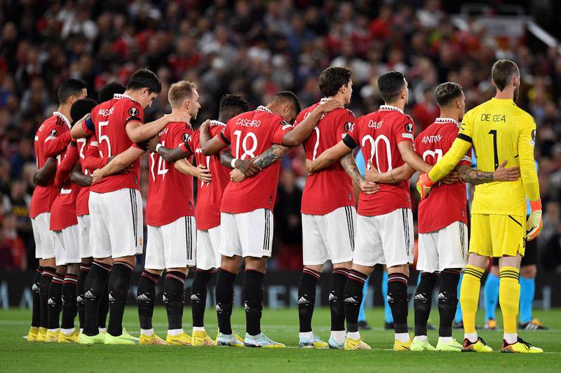 Manchester United players pay tribute following the death of Queen Elizabeth II ahead of the Europa League match againstd Real Sociedad at Old Trafford. AFP