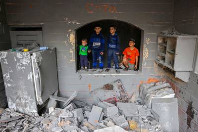 Children inside a damaged building following strikes on Rafah in the southern Gaza Strip. AFP